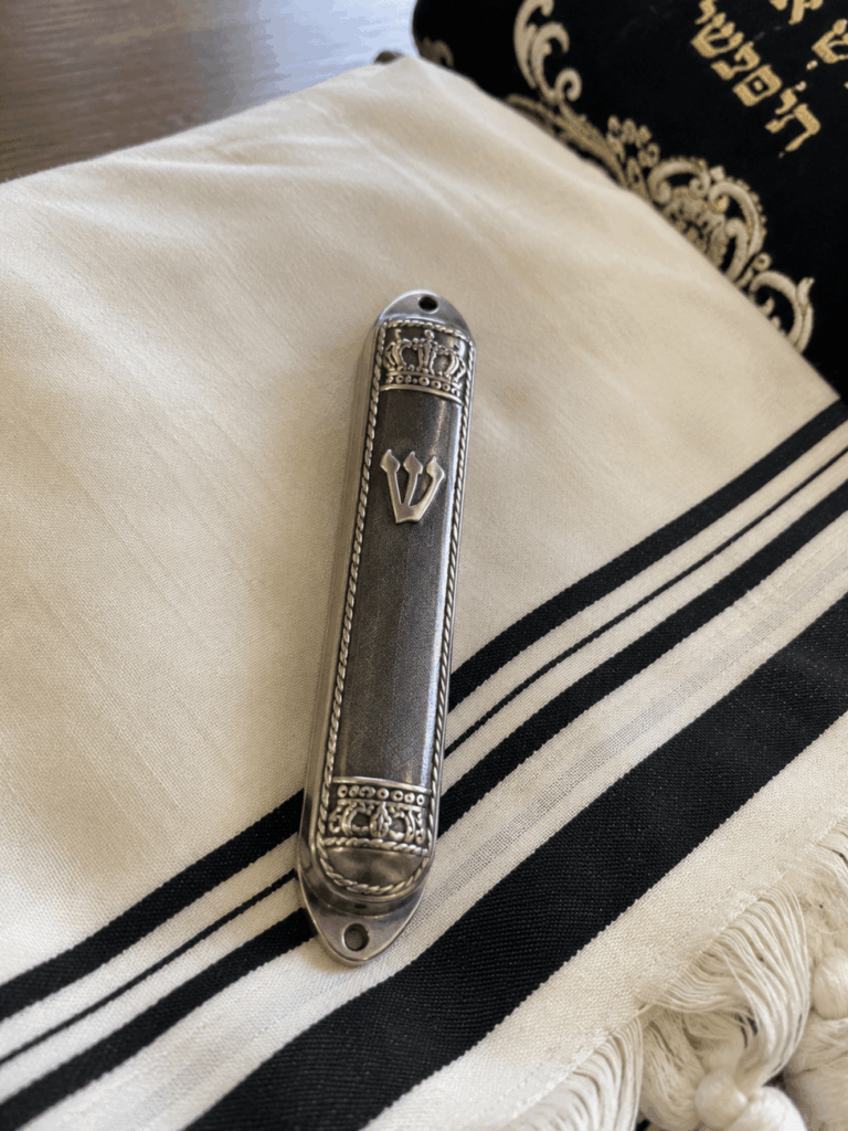 Close-up of a handwritten kosher mezuzah klaf parchment scroll