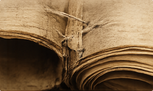 Structural wear on an aging Torah scroll's panels and stitching